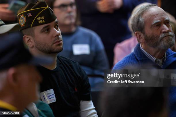 Members of the audience listen to Democrat Conor Lamb, a former U.S. Attorney and US Marine Corps veteran running to represent Pennsylvania's 18th...