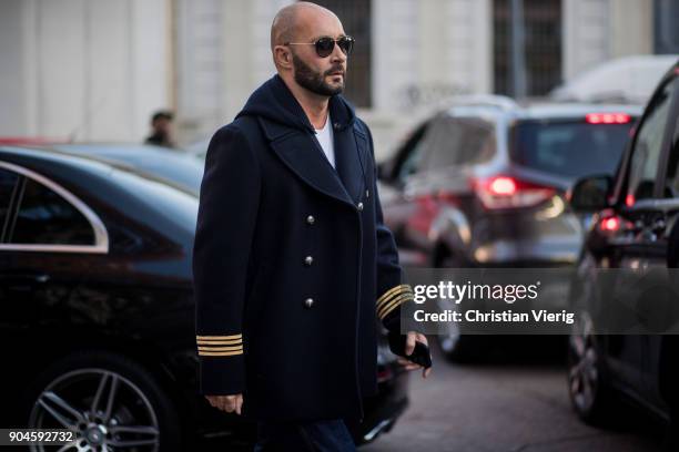 Milan Vukmirovic wearing navy jacket is seen outside Marni during Milan Men's Fashion Week Fall/Winter 2018/19 on January 13, 2018 in Milan, Italy.