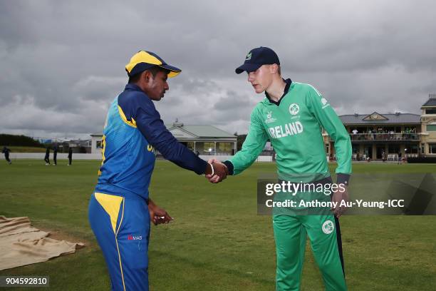 Kamindu Mendis of Sri Lanka and Harry Tector of Ireland shake hands prior to the ICC U19 Cricket World Cup match between Sri Lanka and Ireland at...