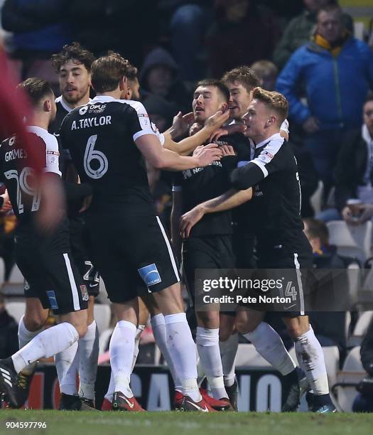 Chris Long of Northamptpn Town is congratulated by team mates after scoring his sdes second goal during the Sky Bet League One match between Bradford...