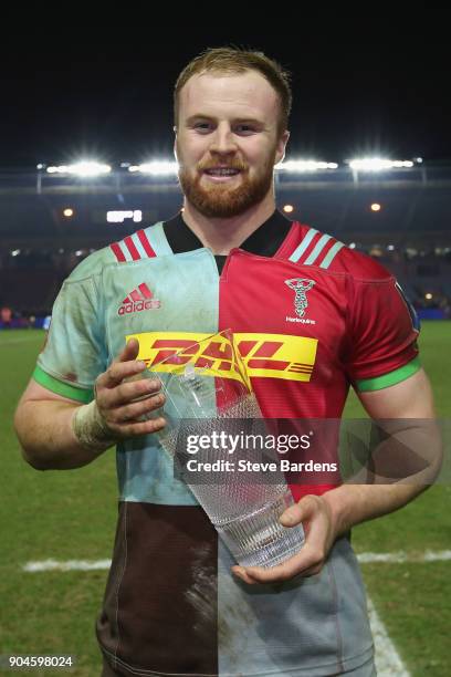 James Chisholm of Harlequins with his man of the match award after the European Rugby Champions Cup match between Harlequins and Wasps at Twickenham...