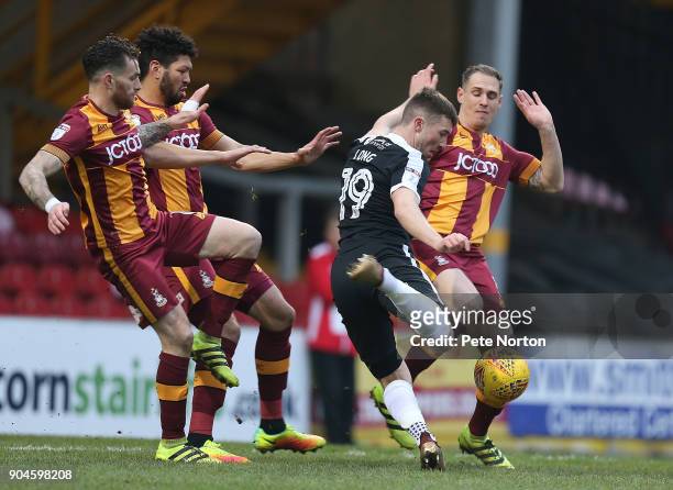 Chris Long of Northampton Town attempts to get a shot at goal away under pressure from Romain Vincelot, Nathaniel Kight-Percivall and Matthew...