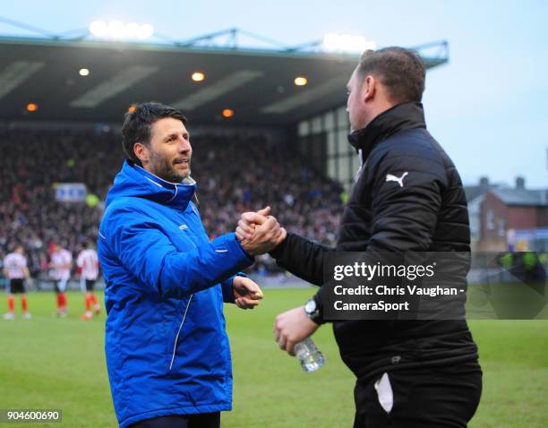 Lincoln City manager Danny Cowley, left, and Notts County manager Kevin Nolan shake hands prior to the Sky Bet League Two match between Lincoln City...