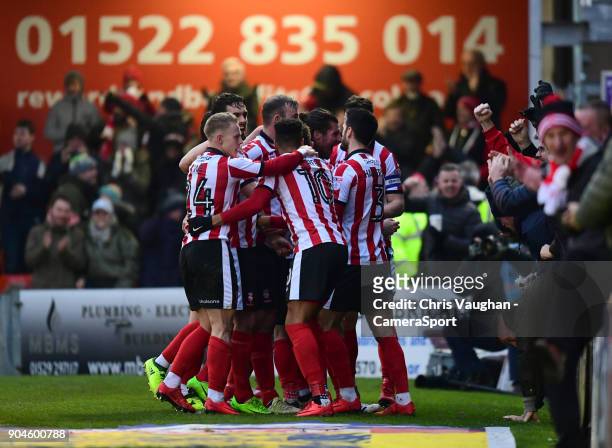 Lincoln City's Lee Frecklington celebrates scoring his sides equalising goal to make the score 1-1 with team-mates during the Sky Bet League Two...
