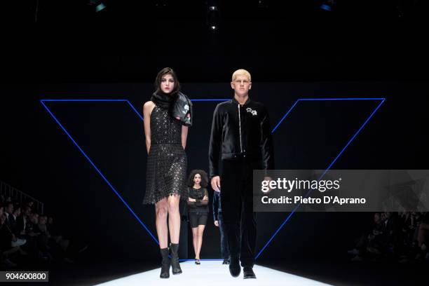 Model walks the runway at the Emporio Armani show during Milan Men's Fashion Week Fall/Winter 2018/19 on January 13, 2018 in Milan, Italy.