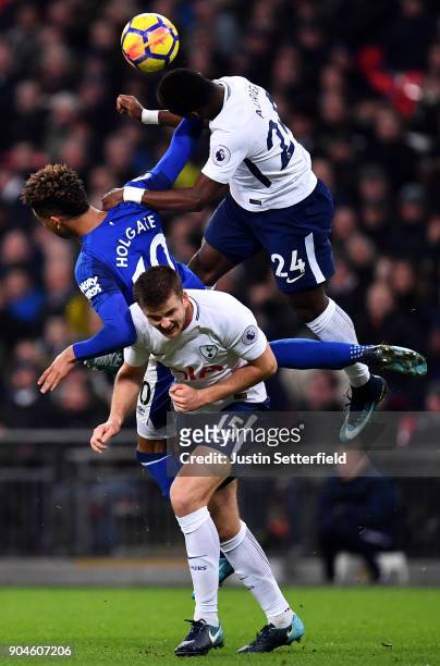Mason Holgate of Everton is challenged by Serge Aurier of Tottenham Hotspur and Eric Dier of Tottenham Hotspur during the Premier League match...