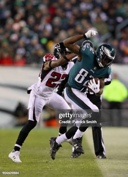 Wide receiver Torrey Smith of the Philadelphia Eagles runs the ball against cornerback Robert Alford of the Atlanta Falcons during the second quarter...