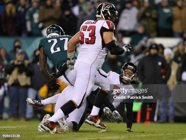 Quarterback Matt Ryan of the Atlanta Falcons falls after throwing the ball against the Philadelphia Eagles during the second quarter in the NFC...