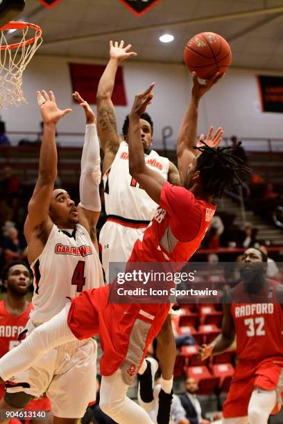 Christian Bradford guard Radford University Highlanders shoots for two against Christian Turner guard and David Efianayi guard Gardner-Webb...