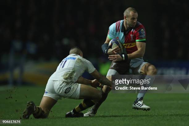Ross Chisholm of Harlequins takes on Marcus Watson of Wasps during the European Rugby Champions Cup match between Harlequins and Wasps at Twickenham...