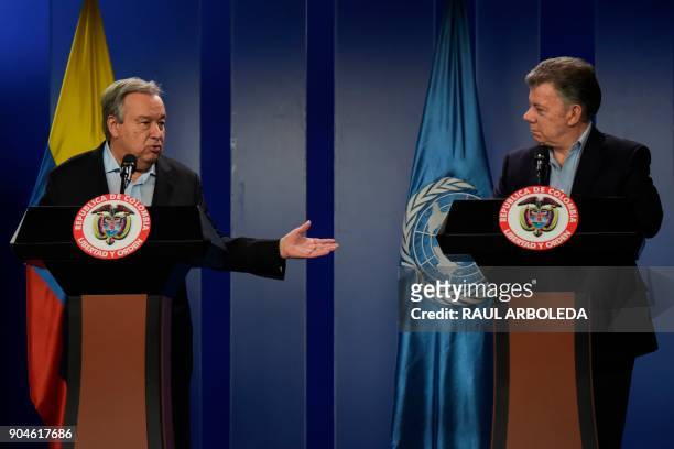 United Nations Secretary-General Antonio Guterres speaks to journalists next to Colombian President Juan Manuel Santos during a press conference at...