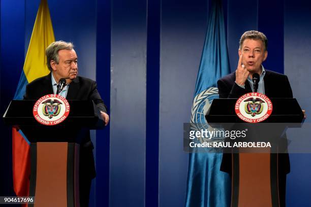 Colombian President Juan Manuel Santos speaks next to United Nations Secretary-General Antonio Guterres during a press conference at the Narino...