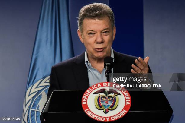 Colombian President Juan Manuel Santos speaks next to United Nations Secretary-General Antonio Guterres during a press conference at the Narino...