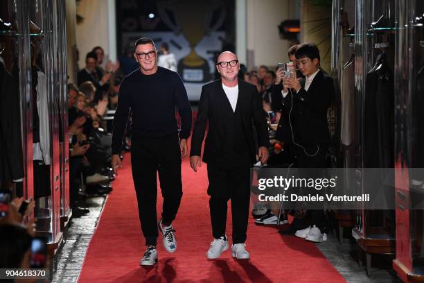 Designers Stefano Gabbana and Domenico Dolce acknowledge the applause of the audience at the Dolce & Gabbana Unexpected Show during Milan Men's...