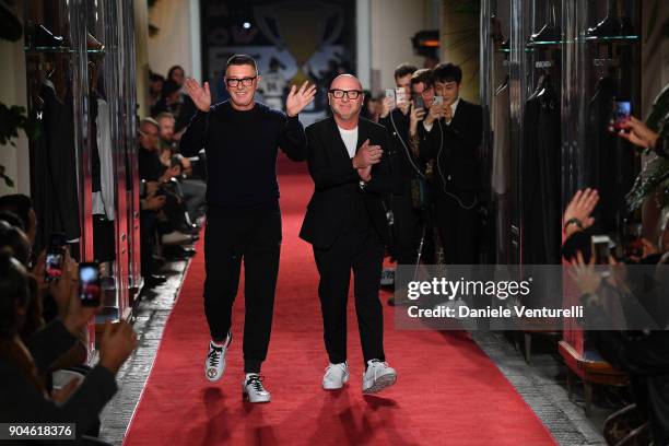 Designers Stefano Gabbana and Domenico Dolce acknowledge the applause of the audience at the Dolce & Gabbana Unexpected Show during Milan Men's...