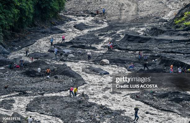 Emerald seekers look for the green gems in the Las Animas river close to an emerald mine in the municipality of Muzo - known as the "emerald capital...