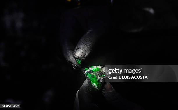 Geologist shows emeralds at a mine in the municipality of Muzo - known as the "emerald capital of the world" - in the Colombian department of Boyaca,...