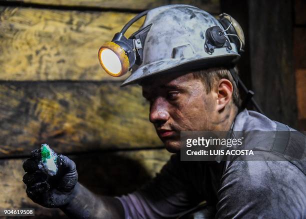 Geologist shows emeralds at a mine in the municipality of Muzo - known as the "emerald capital of the world" - in the Colombian department of Boyaca,...