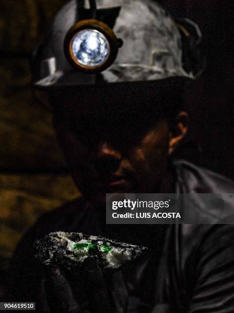 Geologist shows emeralds at a mine in the municipality of Muzo - known as the "emerald capital of the world" - in the Colombian department of Boyaca,...