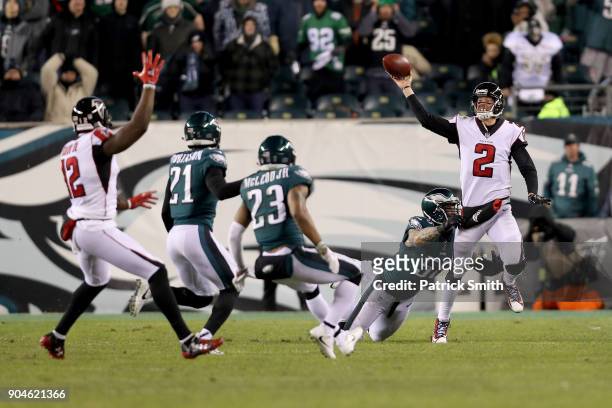Matt Ryan of the Atlanta Falcons looks to throw the ball to Mohamed Sanu against the Philadelphia Eagles during the third quarter in the NFC...