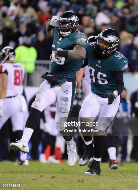 Outside linebacker Nigel Bradham and defensive end Derek Barnett of the Philadelphia Eagles celebrate a sack against quarterback Matt Ryan of the...