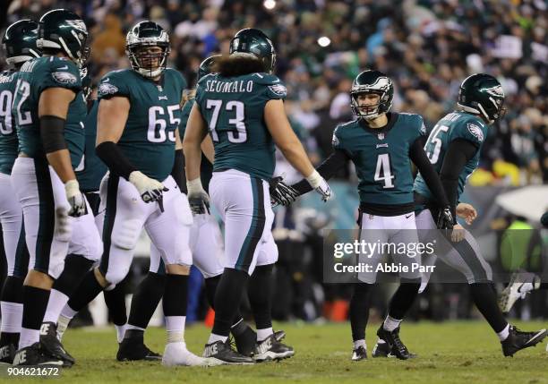 Kicker Jake Elliott of the Philadelphia Eagles celebrates his 21-yard field goal with teammates against the Atlanta Falcons during the third quarter...