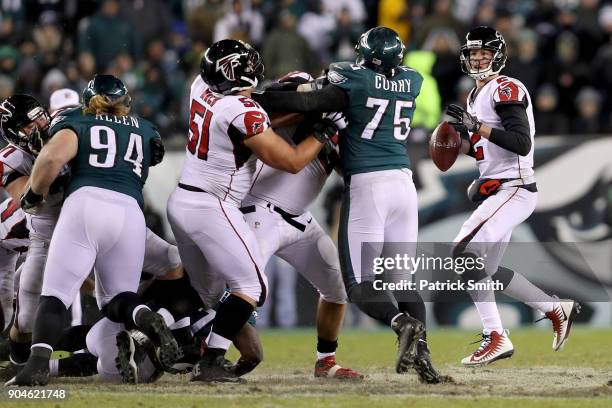 Quarterback Matt Ryan of the Atlanta Falcons looks to pass against the Philadelphia Eagles during the third quarter in the NFC Divisional Playoff...