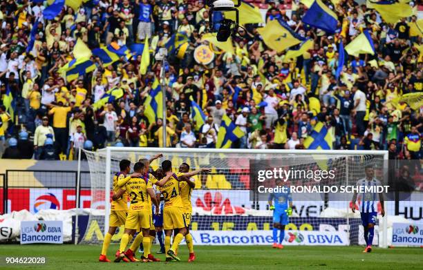 America´s players celebrate a goal against Pachuca during their Mexican Clausura 2018 tournament football match at the Azteca stadium in Mexico City,...