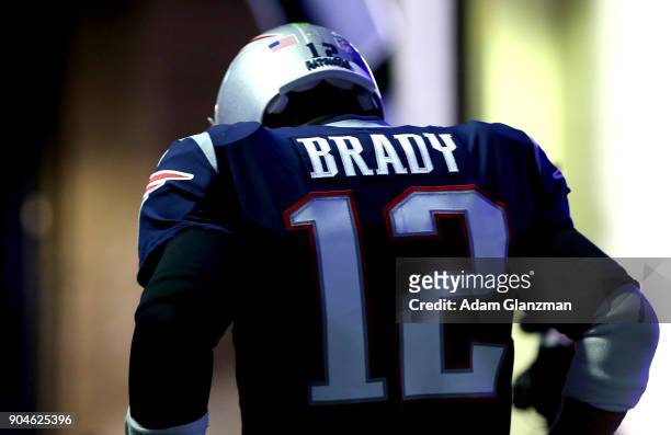 Tom Brady of the New England Patriots runs through the tunnel before the AFC Divisional Playoff game against the Tennessee Titans at Gillette Stadium...