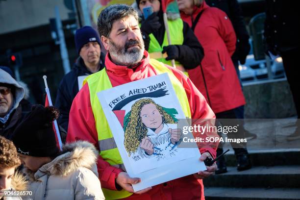 Protester seen holding a placard during the rally. Demonstration of protest against the decision of Donald Trump, in violation of the international...