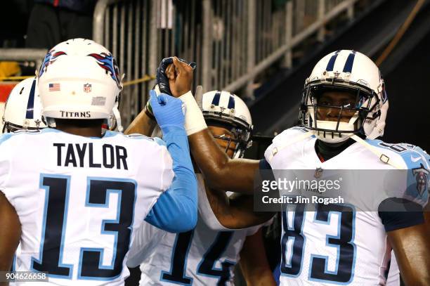 Taywan Taylor and Harry Douglas of the Tennessee Titans react before the AFC Divisional Playoff game against the Tennessee Titans at Gillette Stadium...