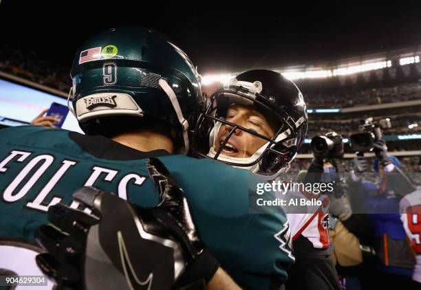 Nick Foles of the Philadelphia Eagles hugs Matt Ryan of the Atlanta Falcons after the NFC Divisional Playoff game at Lincoln Financial Field on...