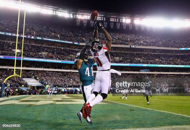 Wide receiver Julio Jones of the Atlanta Falcons attempts to make a catch against cornerback Ronald Darby of the Philadelphia Eagles during the...