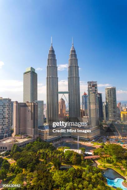 cityscape of kuala lumpur with the petronas towers in the distance, malaysia. - petronas towers stock-fotos und bilder