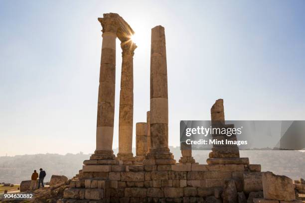 ancient ruin of temple with architrave fragments and columns. - jordan stock pictures, royalty-free photos & images