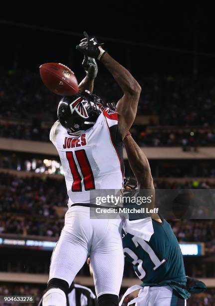 Cornerback Jalen Mills of the Philadelphia Eagles breaks up a pass intended for wide receiver Julio Jones of the Atlanta Falcons at the end of the...