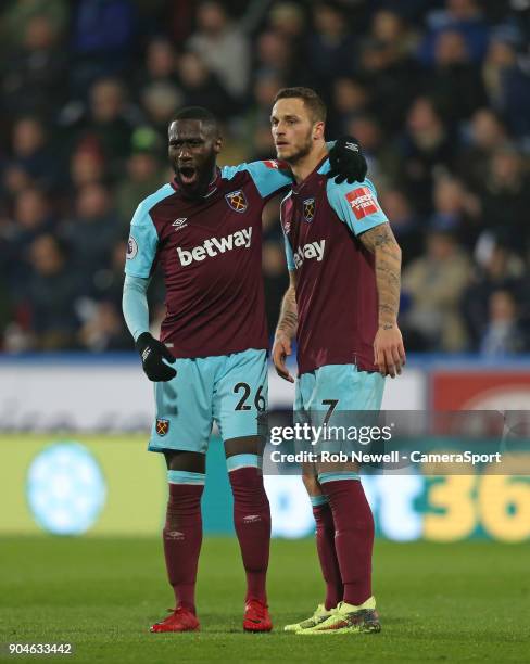 West Ham United's Marko Arnautovic celebrates with Arthur Masuaku during the Premier League match between Huddersfield Town and West Ham United at...