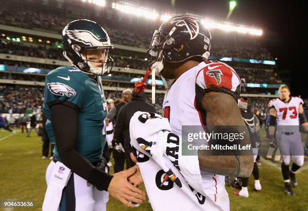 Dom Williams of the Philadelphia Eagles shakes hands with Julio Jones of the Atlanta Falcons after the NFC Divisional Playoff game at Lincoln...