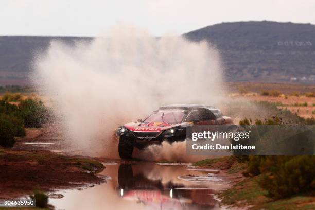 Carlos Sainz of Spain and Peugeot Total drives with co-driver Lucas Cruz of Spain in the 3008 DKR Peugeot car in the Classe : T1.4 2 Roues Motrices,...