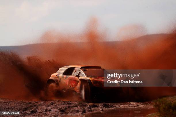 Stephane Peterhansel of France and Peugeot Total drives with co-driver Jean Paul Cottret of France in the 3008 DKR Peugeot car in the Classe : T1.4 2...