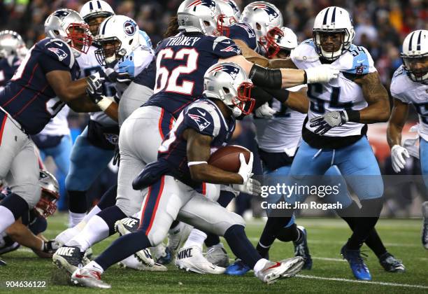 Dion Lewis of the New England Patriots carries the ball in the first quarter of the AFC Divisional Playoff game against the Tennessee Titans at...