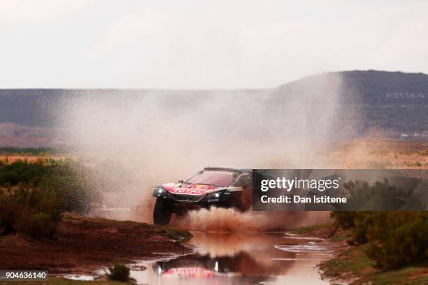 Carlos Sainz of Spain and Peugeot Total drives with co-driver Lucas Cruz of Spain in the 3008 DKR Peugeot car in the Classe : T1.4 2 Roues Motrices,...