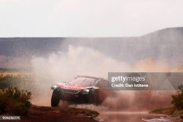 Carlos Sainz of Spain and Peugeot Total drives with co-driver Lucas Cruz of Spain in the 3008 DKR Peugeot car in the Classe : T1.4 2 Roues Motrices,...