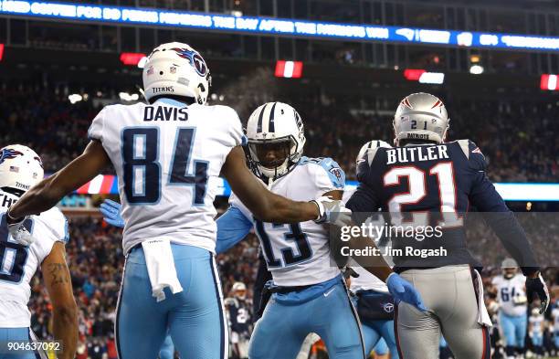 Corey Davis of the Tennessee Titans reacts with Taywan Taylor after catching a touchdown pass in the first quarter of the AFC Divisional Playoff game...