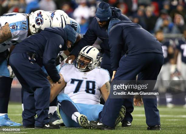 Jack Conklin of the Tennessee Titans is injured in the second quarter of the AFC Divisional Playoff game against the New England Patriots at Gillette...