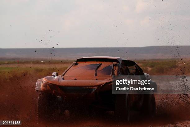 Stephane Peterhansel of France and Peugeot Total drives with co-driver Jean Paul Cottret of France in the 3008 DKR Peugeot car in the Classe : T1.4 2...