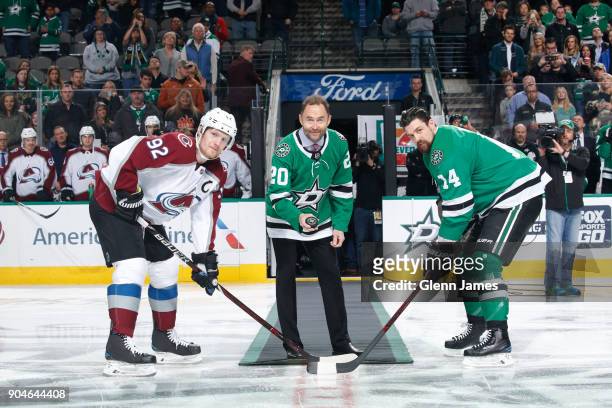 Former Star Ed Belfour comes out to drop a ceremonial puck before a game between Jamie Benn of the Dallas Stars and Gabriel Landeskog of the Colorado...
