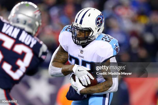 Derrick Henry of the Tennessee Titans carries the ball in the second quarter of the AFC Divisional Playoff game against the New England Patriots at...