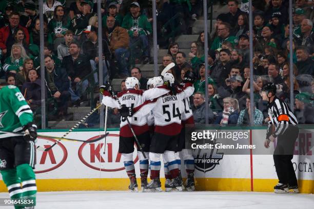 Nail Yakupov, Anton Lindholm and the Colorado Avalanche celebrate a goal against the Dallas Stars at the American Airlines Center on January 13, 2018...