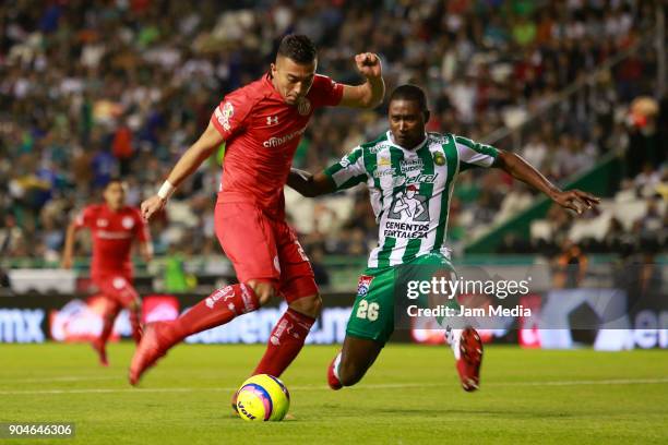 Fernando Uribe of Toluca and Andres Mosquera of Leon fight for the ball during the second round match between Leon and Toluca as part of the Torneo...